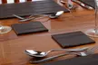 Set of Four Inspire Faux Leather Placemats or Coasters in Black or Brown - Image 4