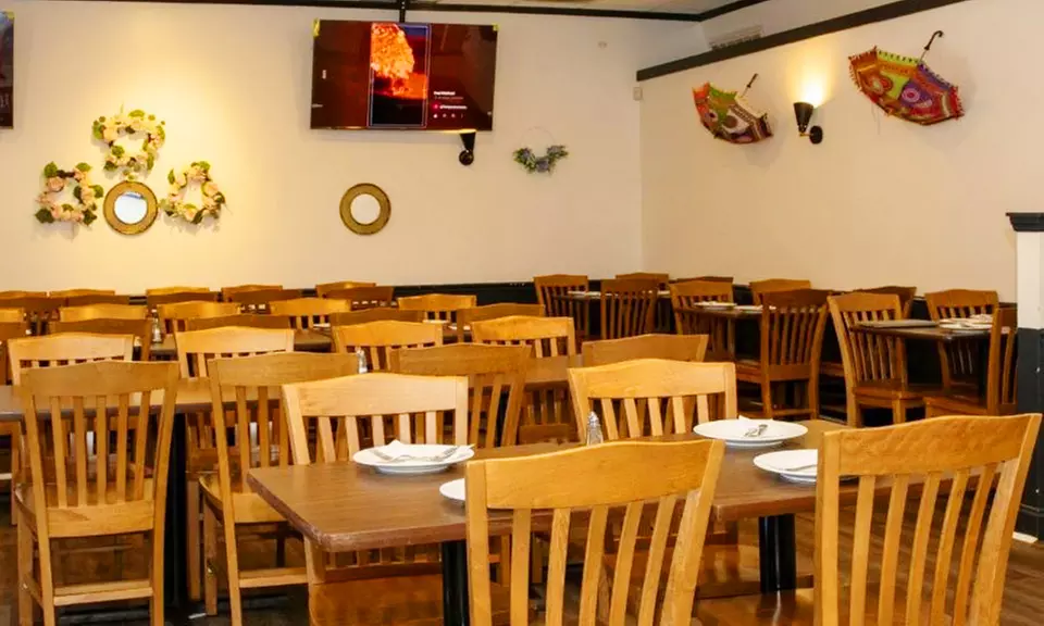 $25 or $50 Toward Food and Drink Or Dinner with Drink for Two/Four