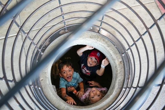 Guests climbing and ziplining inside Fritz’s indoor adventure park