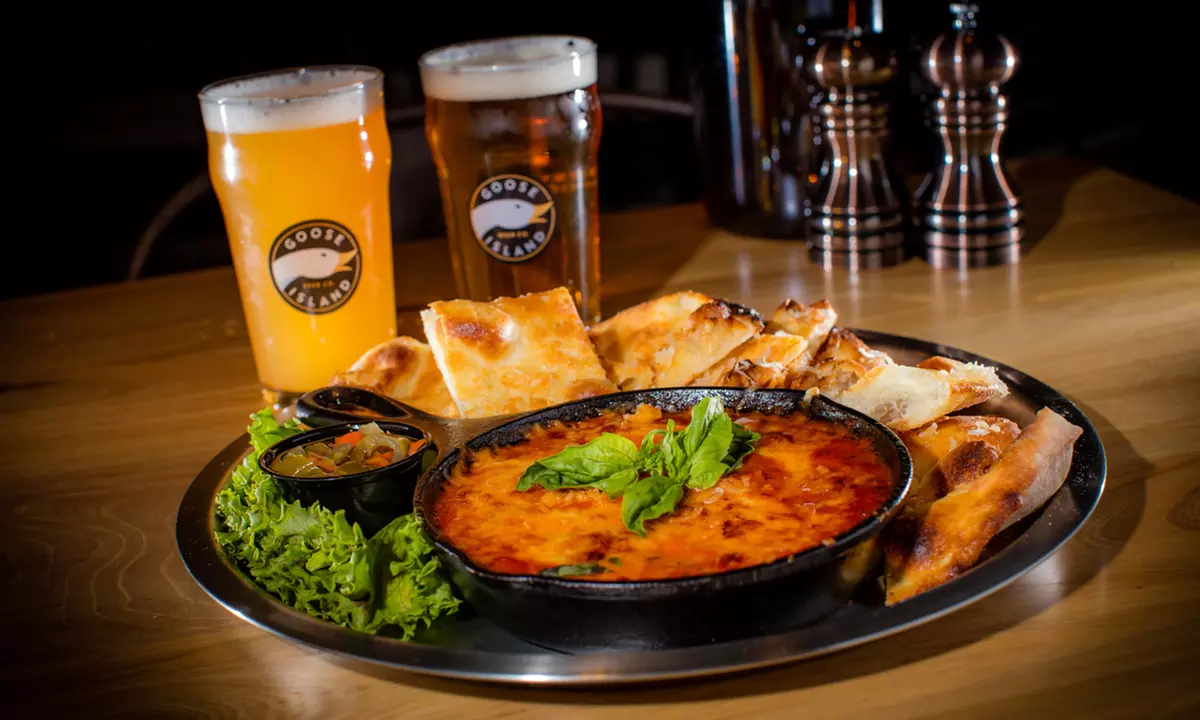 Food and Drinks for Two or Beer Flight and Appetizer Platter for Two or Four at Goose Island Pub (Up to 44% Off) - Second Medium