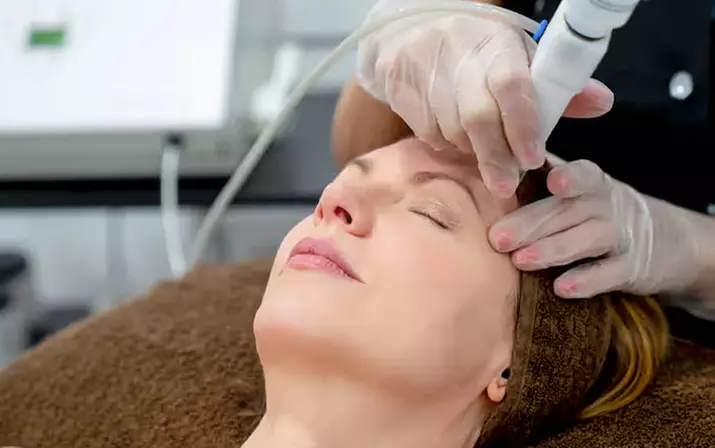 1 or 2 Laser Genesis Facial Sessions at Wildflower Spa – Reduce Wrinkles, Acne Scars & Redness (Up to 51%Off) - Primary Image