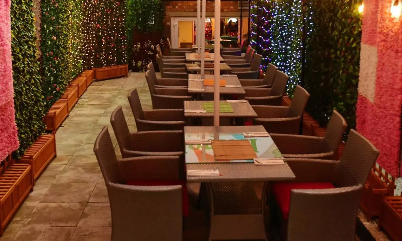 Savor Delicious Steak with Fries, Salad, Sauce and a Glass of Wine