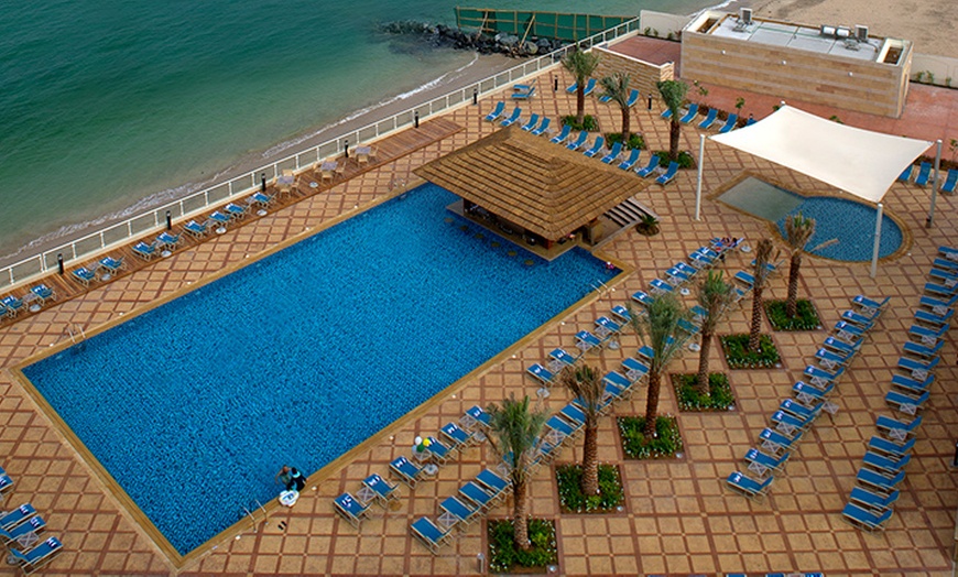 Image 1: Pool and Beach Access with F&B Credit Up to AED 200