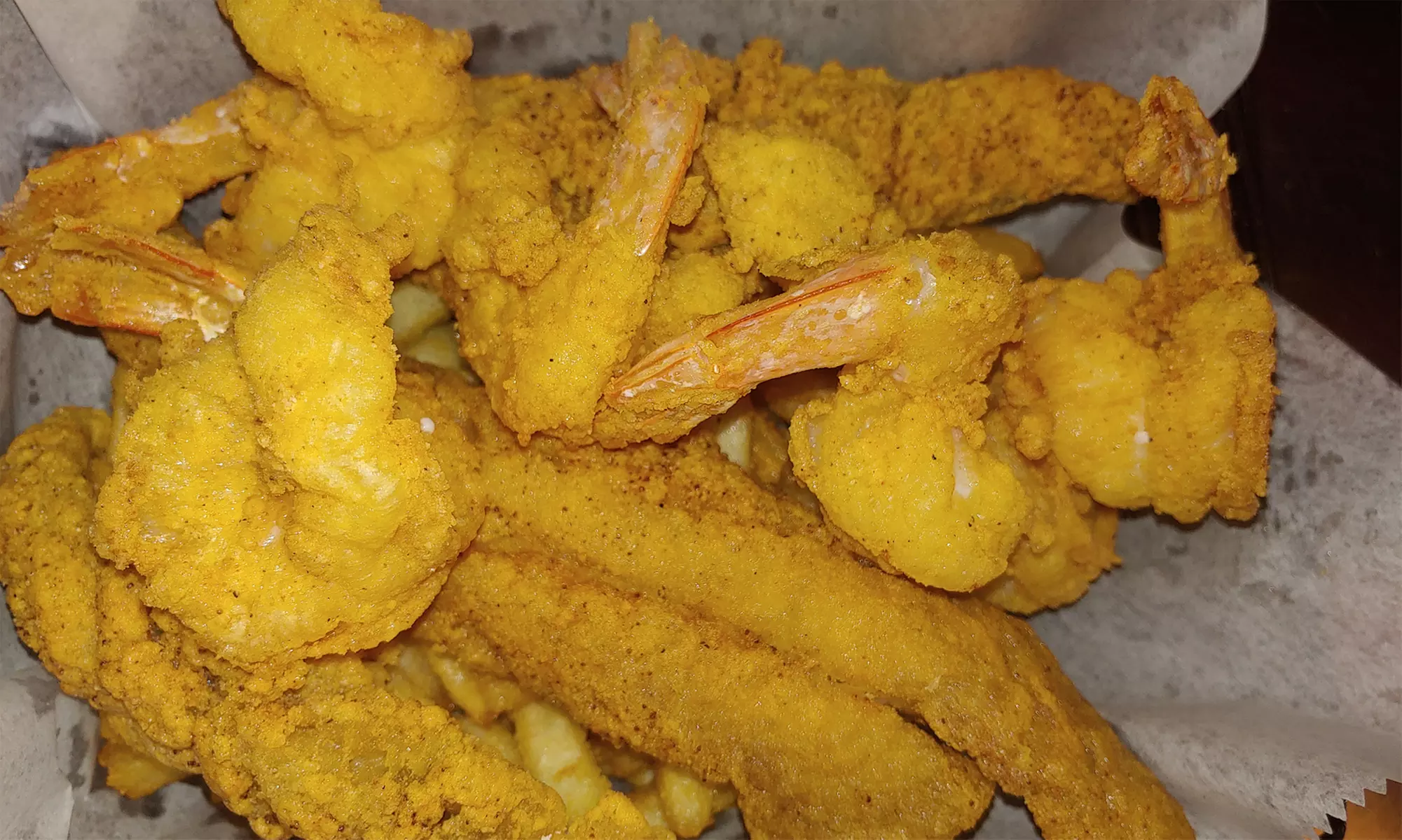 Food and Drink for Takeout and Dine-In if Available at Fish & Chikzz (Up to 28% Off). Two Options Available. - Primary Image