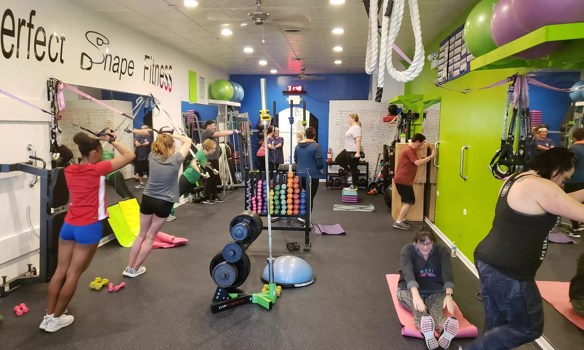 Perfect Shape Fitness offers diverse group training classes for all levels with up to 50% off, promoting core strength and flexibility - Primary Image