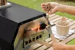 Horno de pellets para pizza con pala y bolsa de transporte, de Innovagoods - Second Medium