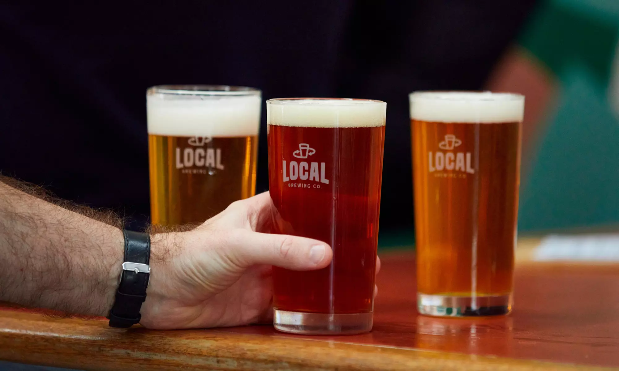 Enjoy a pizza and pint with sides for Two or Four at Local Brewing Co