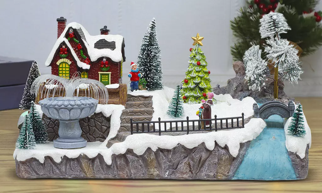 Adorno navideño "Aldea de Navidad" con luces de colores y melodía