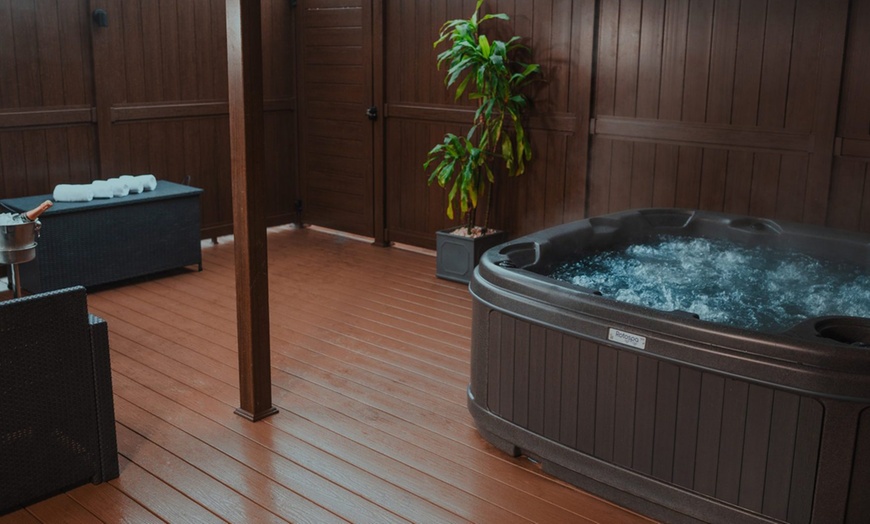 Image 3: Indulge in Tranquility: Relax and Unwind in a Hot Tub 