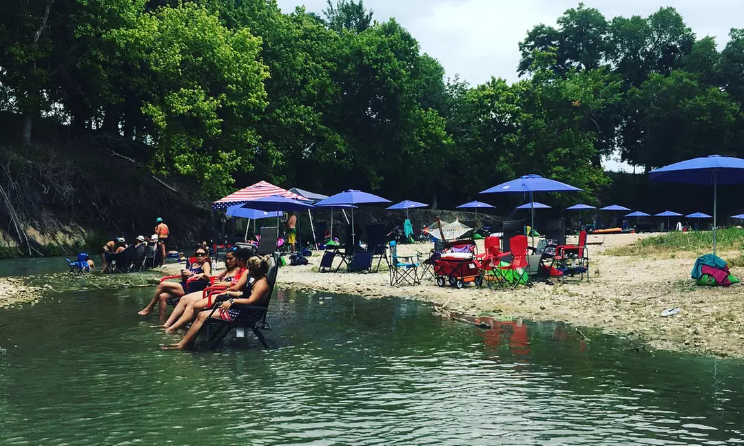 $75 for Tubing for Four on the San Marcos River with Shuttle Pass from Son's Blue River Camp ($140 Value) - Primary Image