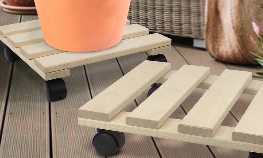 Image 2: Set of 2 Natural Wooden Plant Pot Holders with 4 Wheel Castors