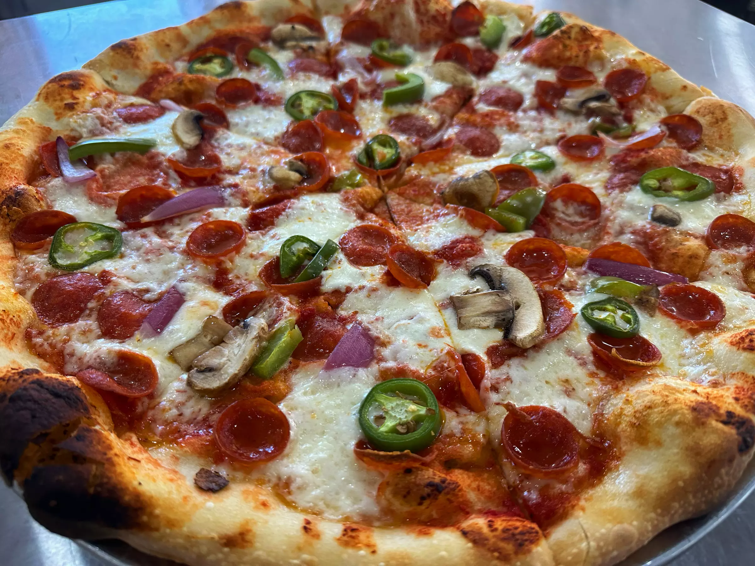 $25, $50 or $100 Voucher Toward Food and Drinks at High Stakes Pizza (up to 40% Off) - Primary Image