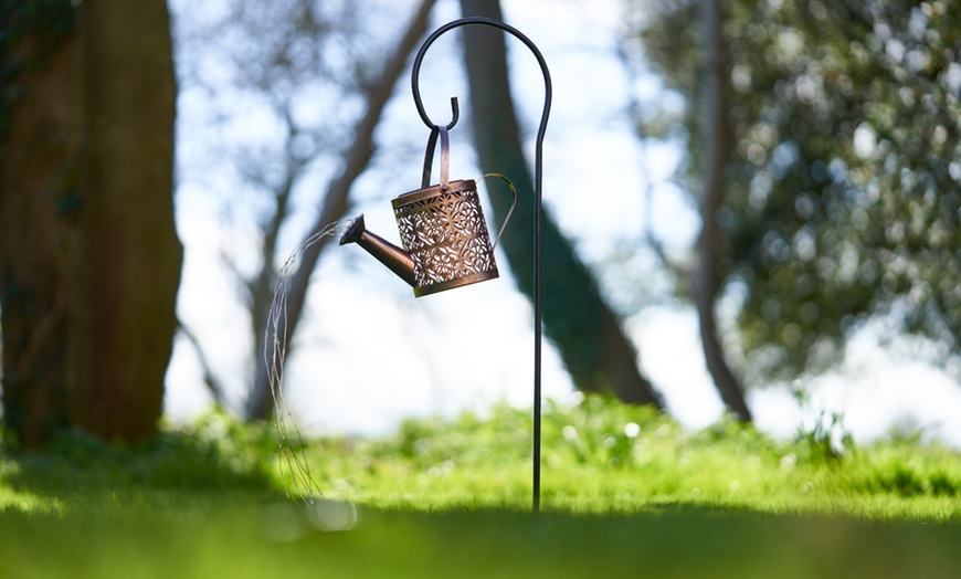 Image 10: Solar-Powered Illuminated Metal Watering Can Ornament