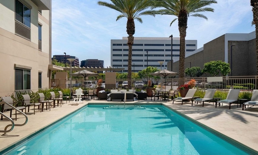 Image 9: Courtyard-Style Hotel Retreat with Outdoor Pool & Bistro Dining