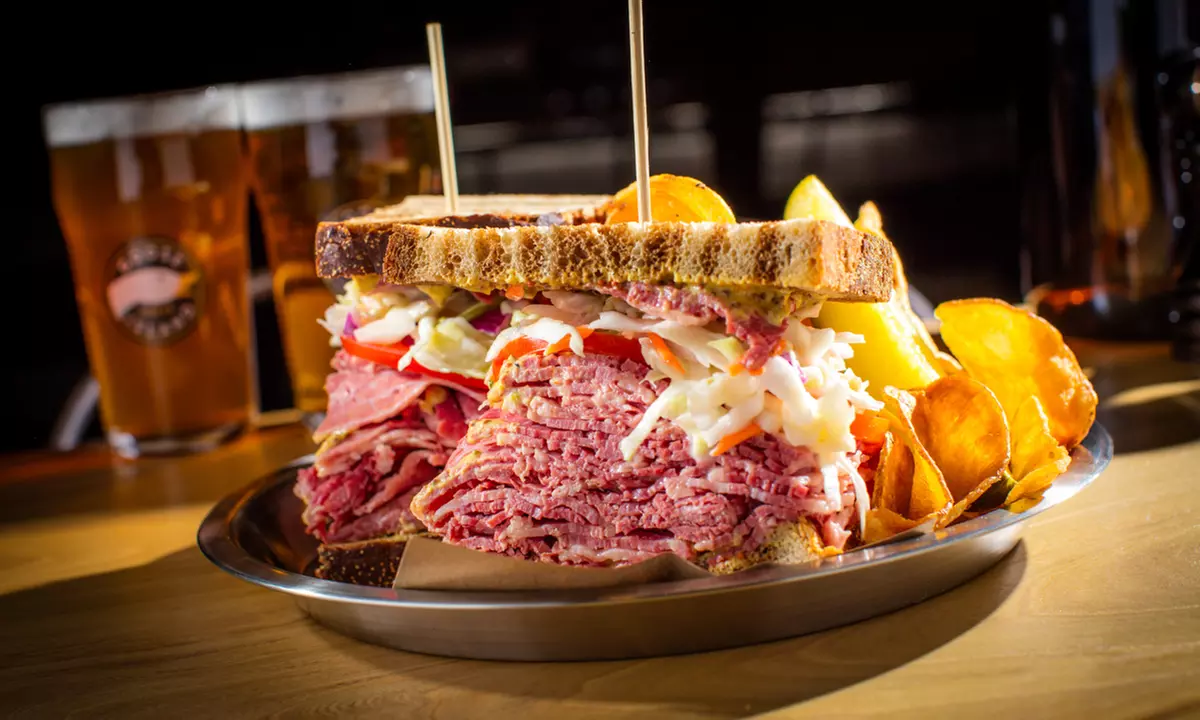 Food and Drinks for Two or Beer Flight and Appetizer Platter for Two or Four at Goose Island Pub (Up to 44% Off) - Primary Image