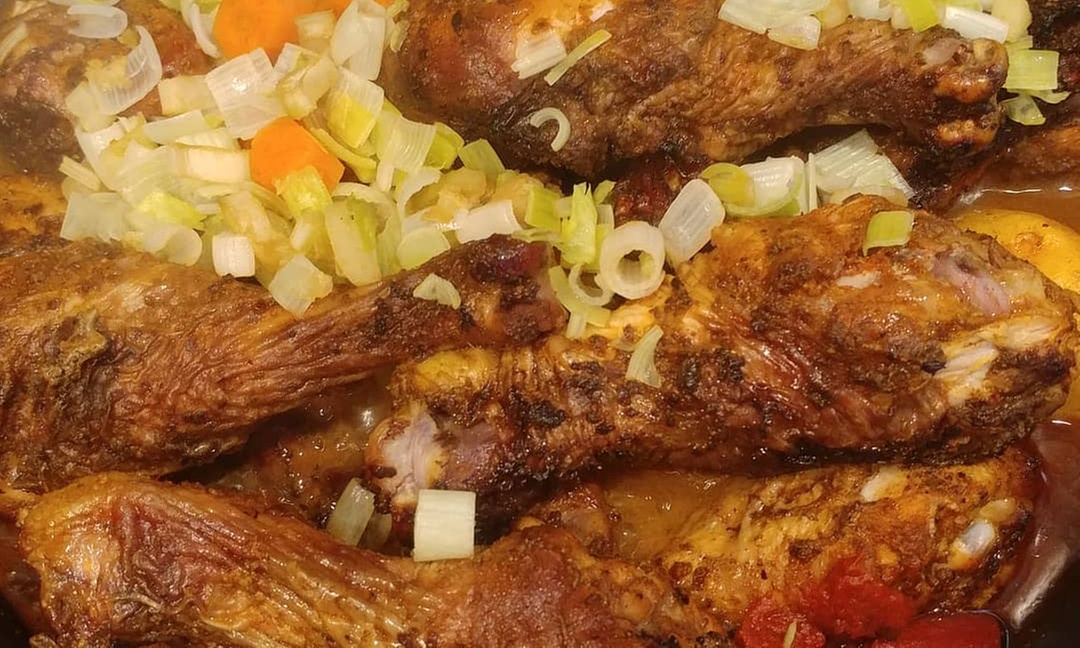 Choice of Entre (Jerk Chicken, Curry & More) with Beverage for 1 or 2