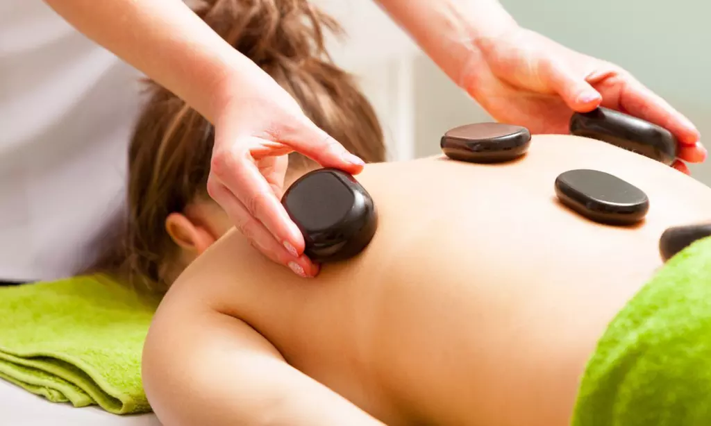 One or Two 60-Minute Swedish Massages with Hot Stones at Hairology 918 ( Up to 34% Off ) - Primary Image