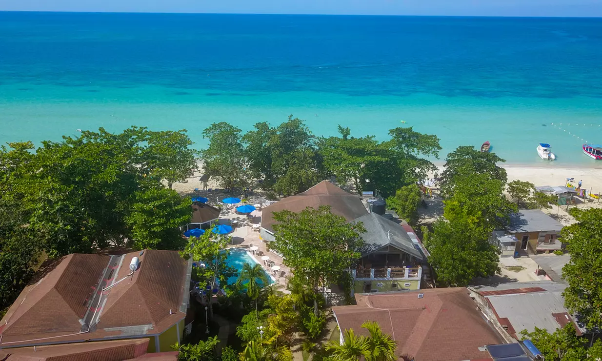 ✈ 4-Night All-Inclusive Merrils Beach Resort II. Price is per person, Based on Two Guests per Room. - Primary Image