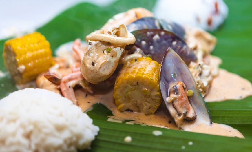 Image 9: Seafood with Rice, and Ice Tea