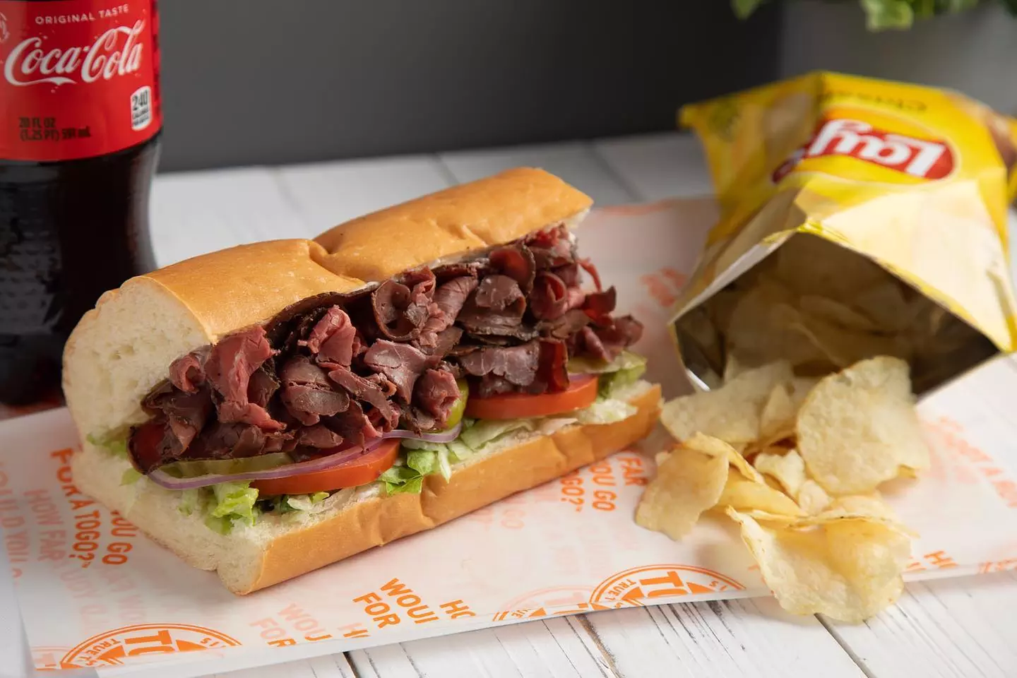 Food and Drink for Takeout and Dine-In if Available at TOGO'S Sandwiches (Up to 30% Off). Two Options Available. - Primary Image