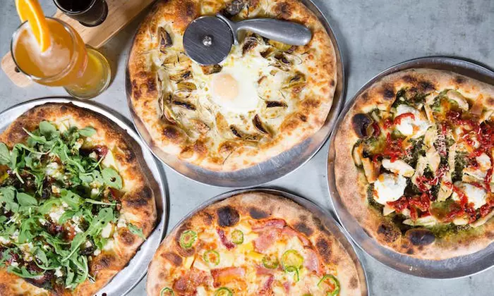 Two vouchers for Wood Fire Cooking, Each Worth $15 Community Pizza House, 33% Off - Primary Image