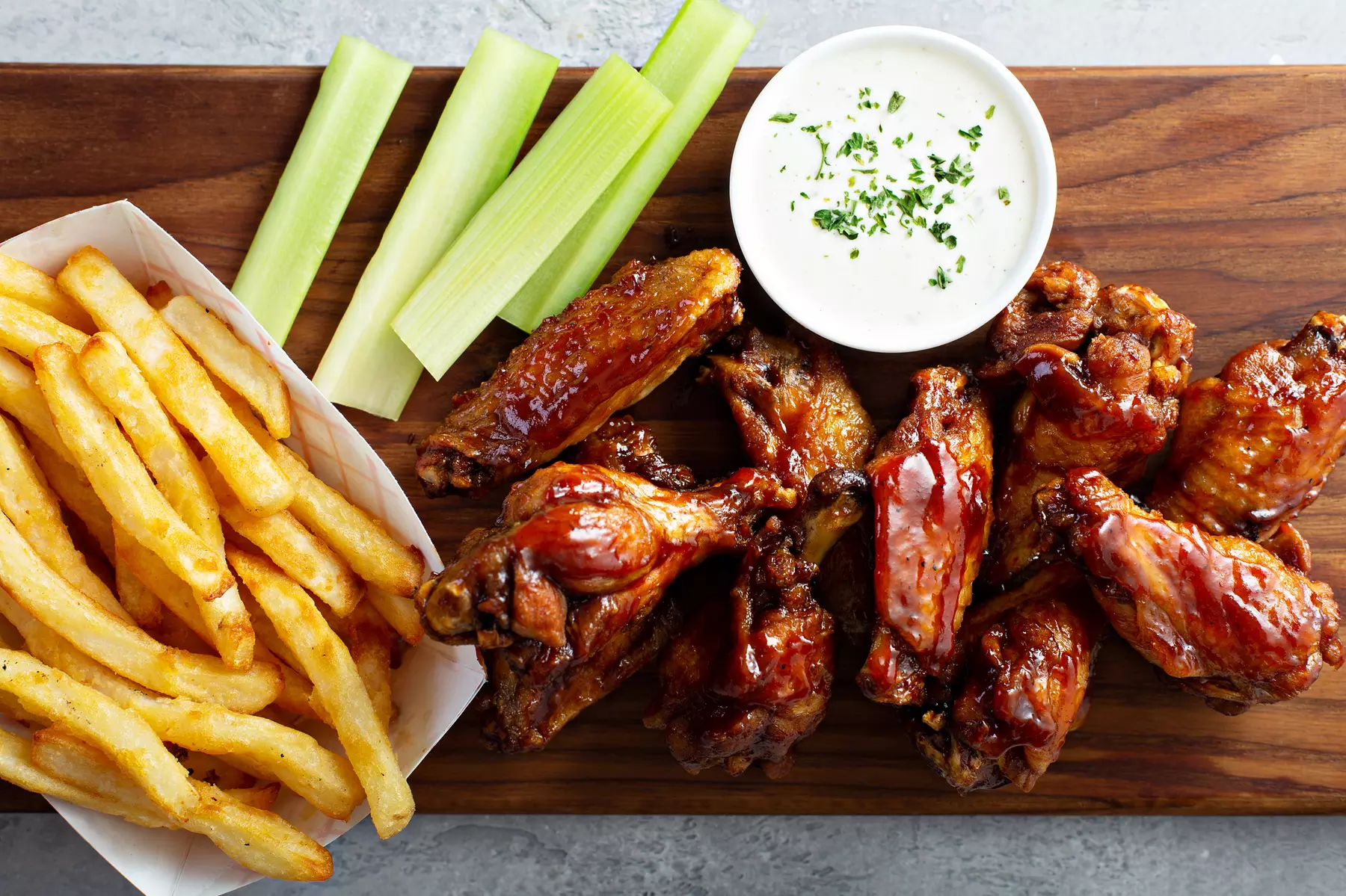 Feast Like a BBQ Boss with $25, $50, and $100 Towards Food & Drinks - Wings, Ribs, & More (Up To 30% Off) - Primary Image