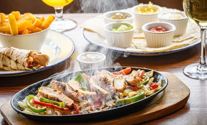 Image 3: Two Starters and Two Skillets at ⭑★ Sizzling Pub & Grill ★⭑