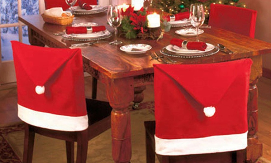 Image 2: Santa Hat Dining Chair Covers
