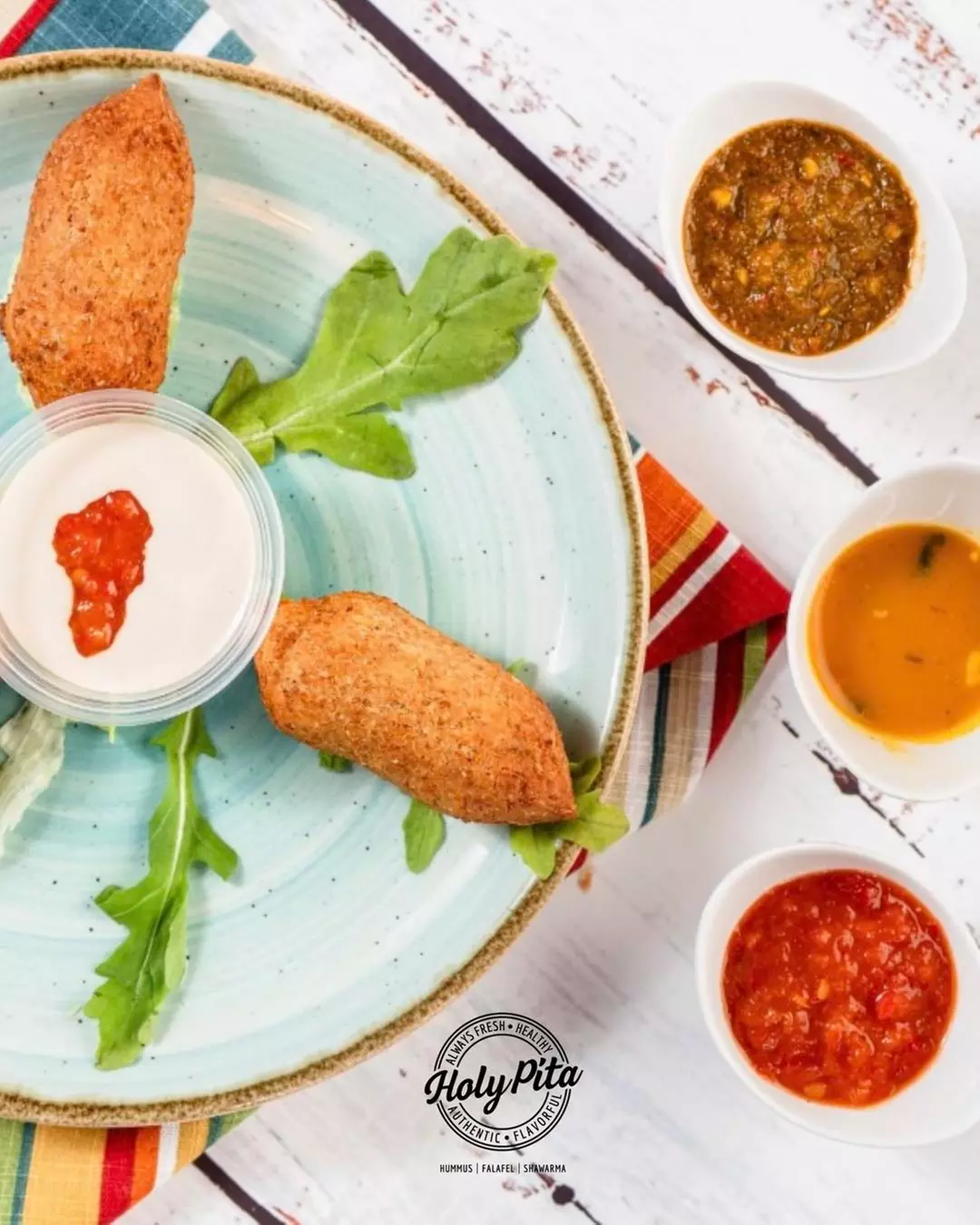 Authentic Mediterranean Delights Await: $30 or $60 to Use at Holy Pita