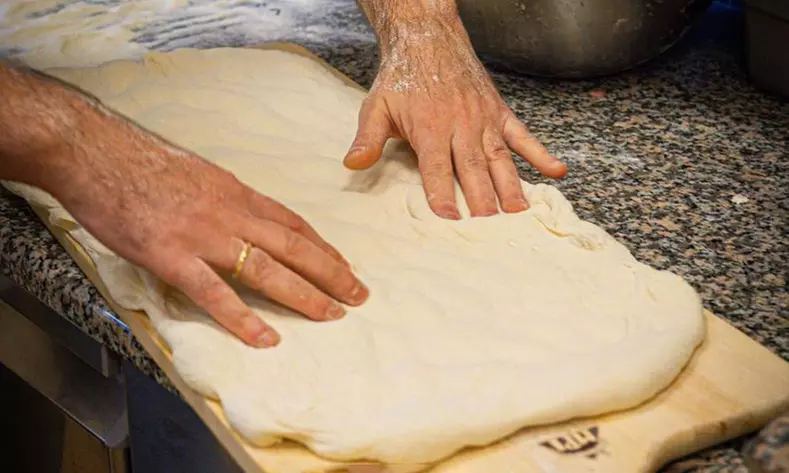 Enjoy a Pizza Making Class for One, Two, or Four with Drinks