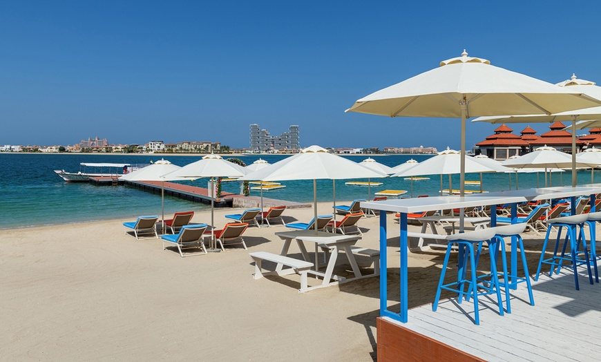 Image 1: 4* Pool and Beach Access with Credits: Child (AED 39), Adult (AED 79)