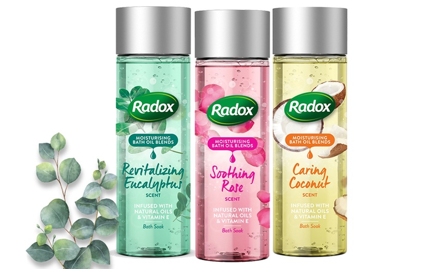 Image 1: Six Bottles of Radox Bath Oil