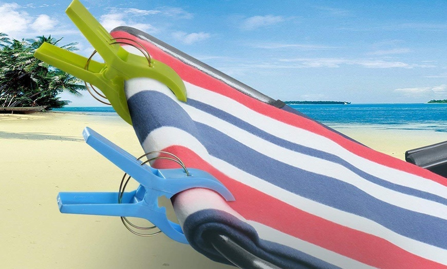 Image 1: Eight Large Beach Towel Pegs