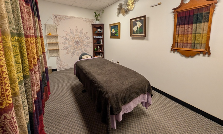 Image 1: Up to 54% Off!! Tailored Massage + FREE Hot Stones/Cupping
