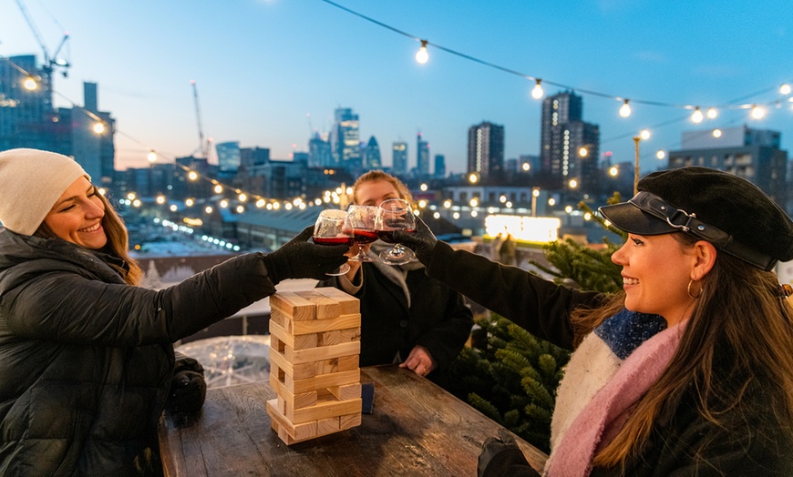 Image 2: Rooftop Ice Skating with meal, Raclette or Cocktails