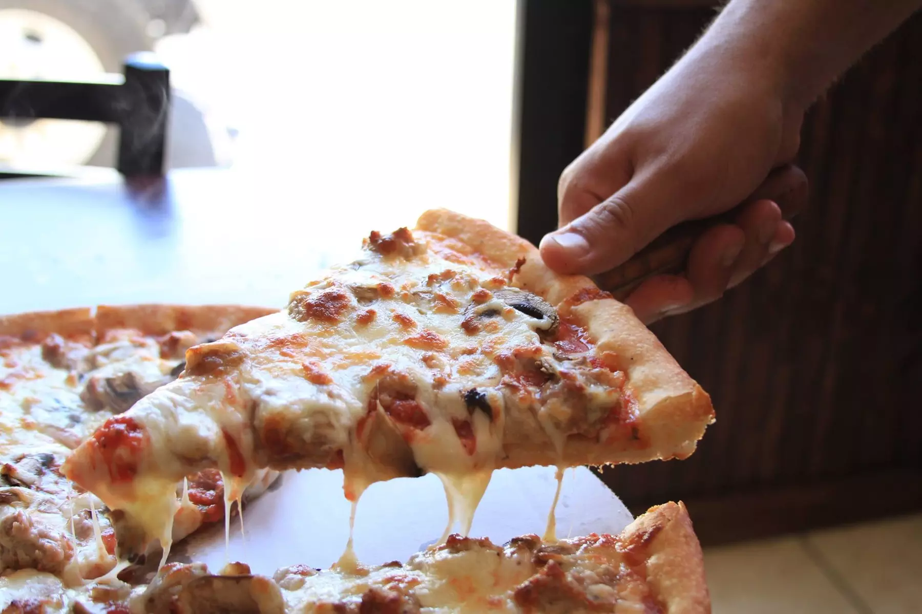 Enjoy 2 Medium Pizzas or a Family Combo with Pizza, Wings, and Soda