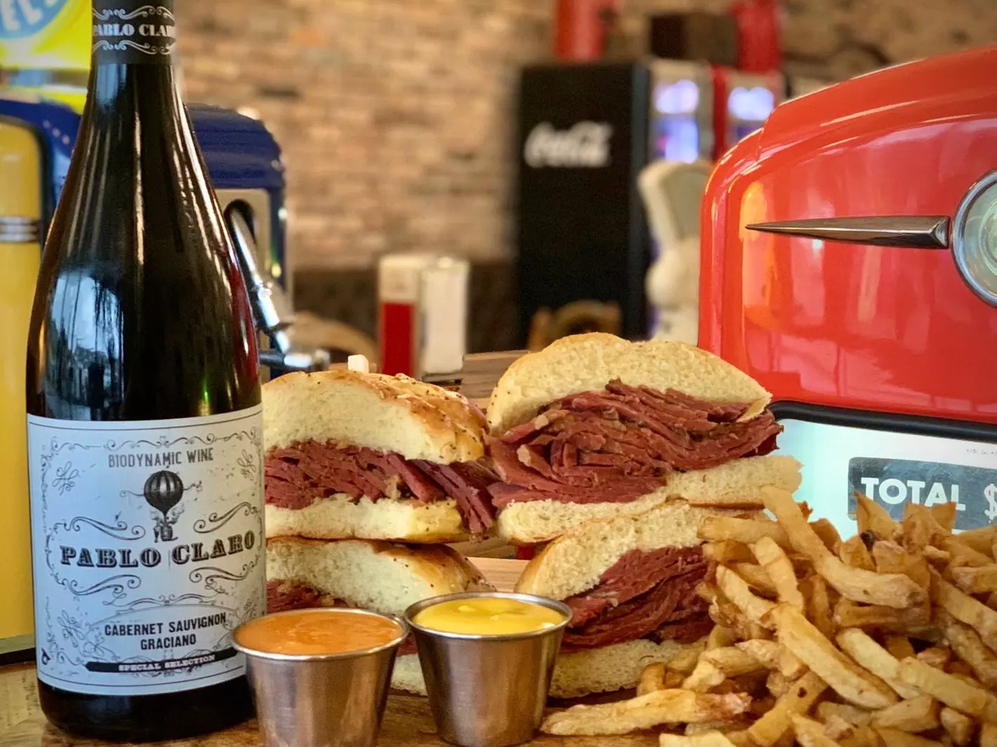 Two Montreal  Sandwiches, Two Sides of Fresh-Cut Fries, and Wine or Beer at The Corned Beef House (Up to 25% Off) - Primary Image