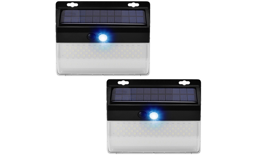 Image 2: Up to Four Packs of 136 LED Solar Motion Sensor Lights