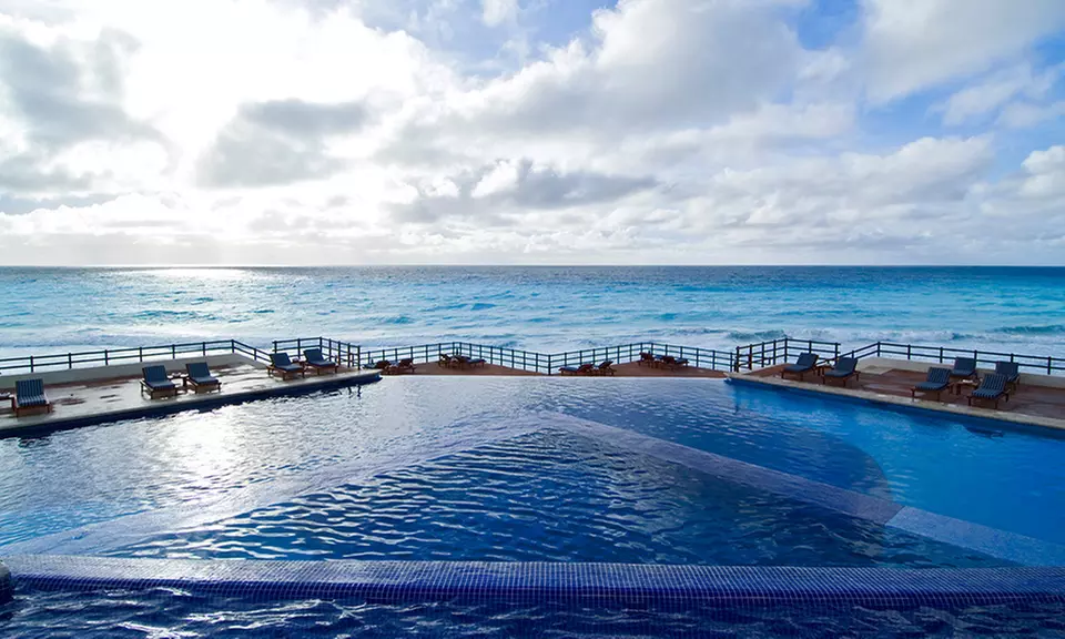 ✈ 3-, 4-, 5-, 6-, or 7-Night Grand Oasis Sens Stay with Nonstop Airfare. Price per Person Based on Double Occupancy. - Primary Image