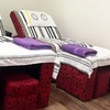Image 1: Relax with 60-Minute Deluxe Body or Custom Combo Massage with Hot Stone & Optional Massage Oil (Up to 61% Off)