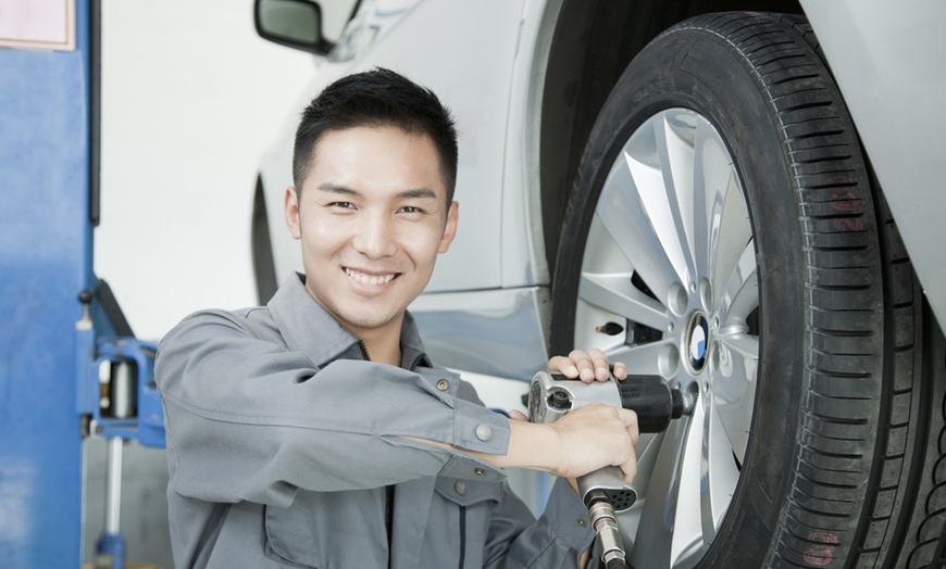 Image 1: Quick and Reliable Tire Rotation for Sedan/Car or SUV/Truck