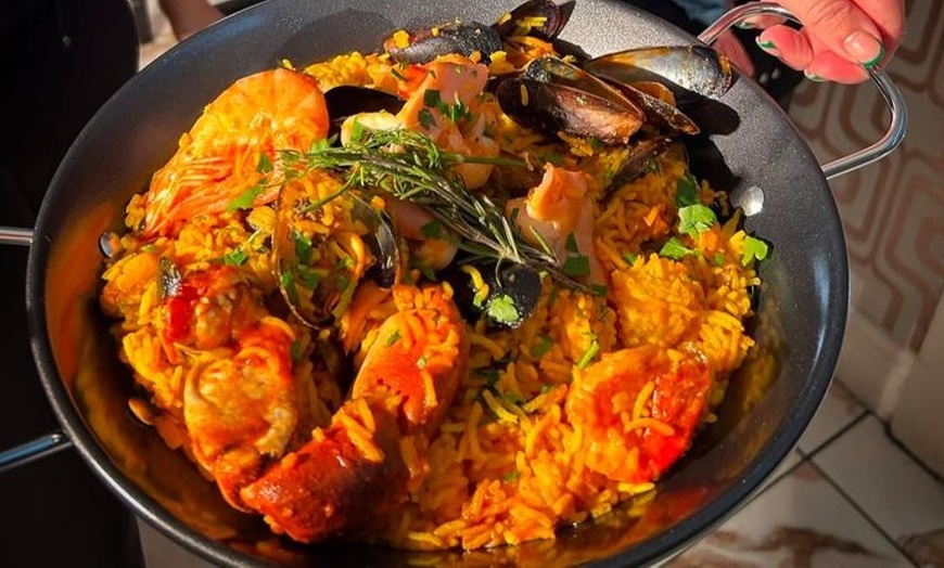 Image 2: Seafood or Chicken Paella with Sangria for Two or Four at Tarantino's 