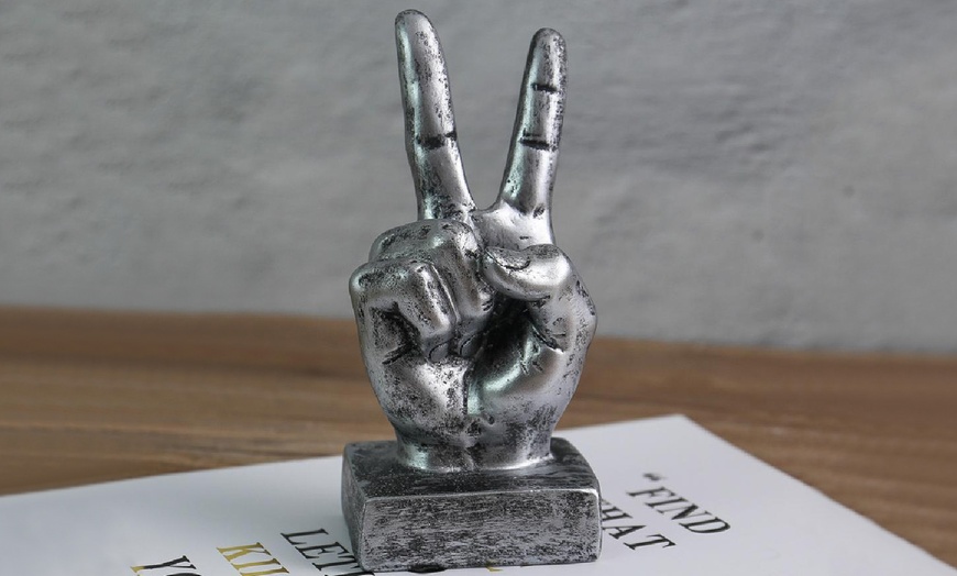 Image 8: Hand Gesture Statue