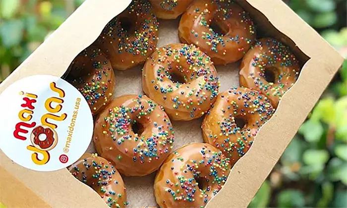 One Dozen of Glazed or Specialty Donuts or Two Donuts at Maxi Donas (Up to 41% Off) - Second Medium