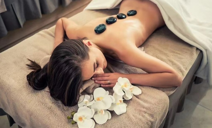 Image 1: Experience ultimate Zen at Oasis Spa: 60-Min Couples Massage & Foot Massage w/ soothing Hot Stones (Up to 35% off)