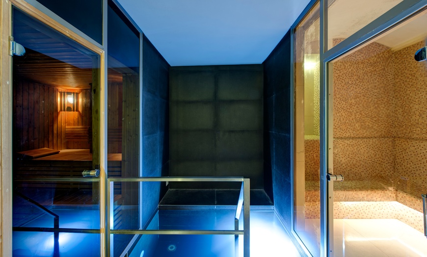 Image 3: Relax with Pool, Sauna, and Steam Access at A Five-Star Hotel