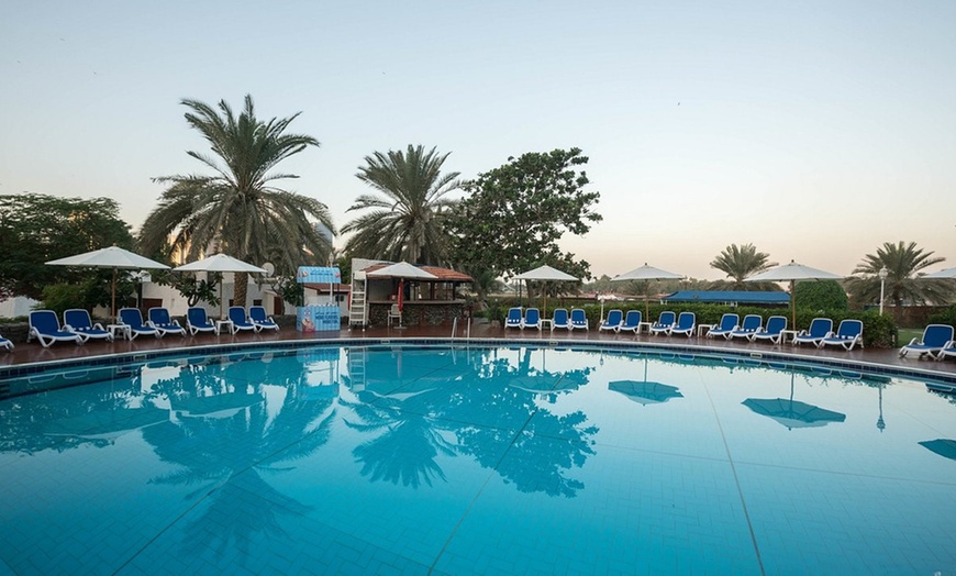 Image 2: Dive into Relaxation and Refreshments at the Cascade Pool Bar Oasis  