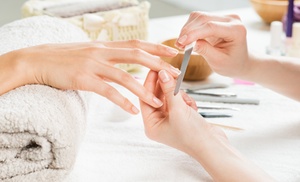 Indulge in a Deluxe Mani & Pedi, Manicure, or Pedicure