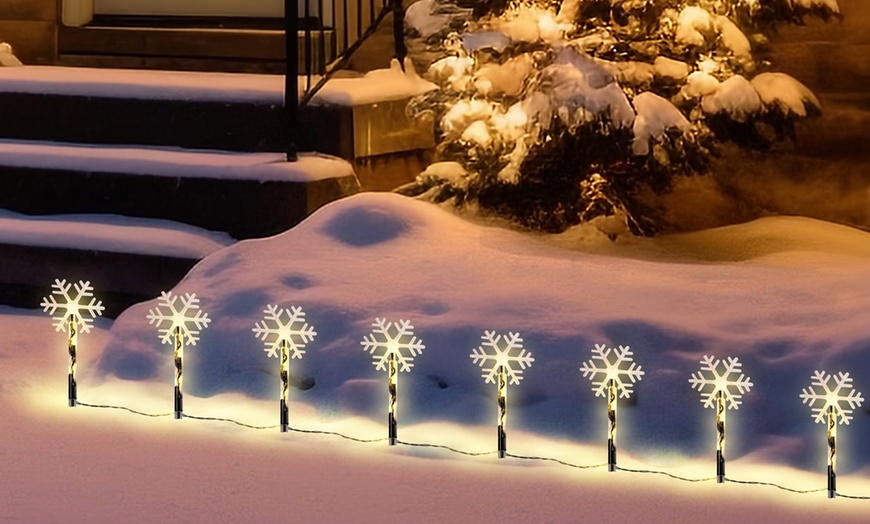 Image 2: Eight-Pack Snowflake LED Pathway Lights
