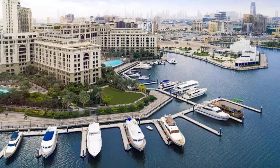 Dubai Canal dhow dinner cruise with soft beverages and live shows